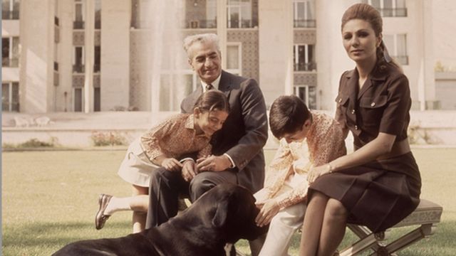 A photo of the Iranian royal family with a dog