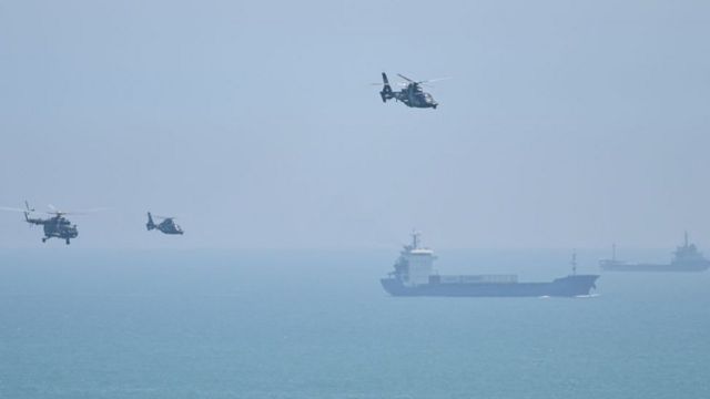 Chinese military helicopters fly over Picton Island.