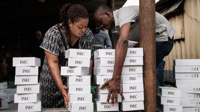 Nigerian electoral officials with card-reading machines