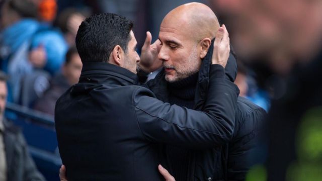 Manchester City manager Pep Guardiola and Arsenal manager Mikel Arteta greet each other