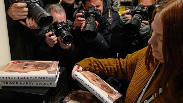 The press gathers at a library in London at midnight on January 10 ahead of a book launch 