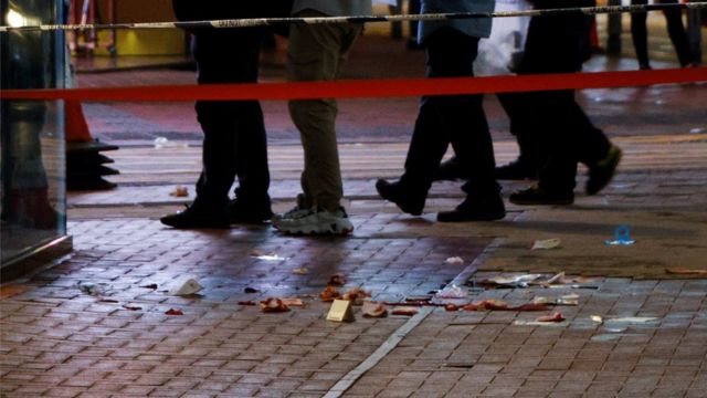 The incident occurred in a downtown area in Causeway Bay, where blood stains were left on the scene.