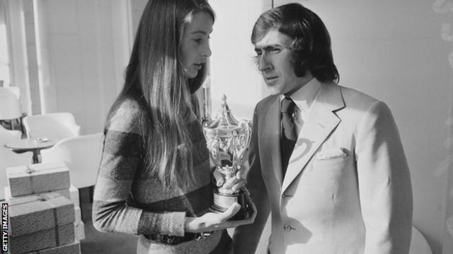Scottish racing driver Jackie Stewart pictured with Nina Rindt, widow of Austrian racing driver Jochen Rindt, in London on 18th November 1970