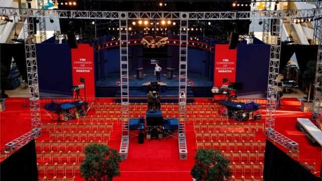 A worker inspects the debate stage