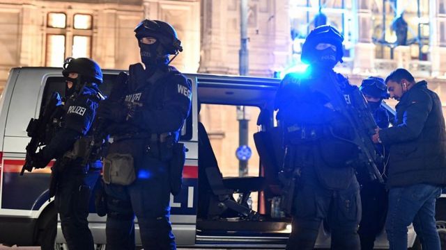 Armed police protect the opera building.