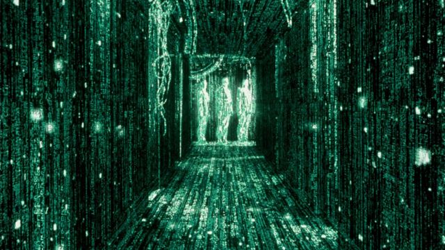 A green image from the Matrix, with three figures at the end of a corridor