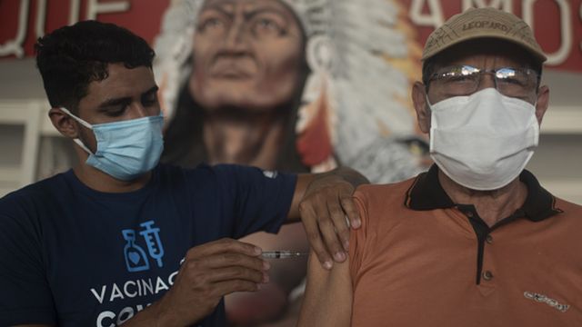 man receives vaccine in the arm