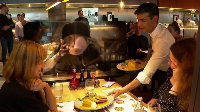 Rishi Sunak serving meals to customers