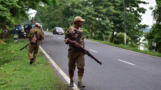Forest officials stand guard in Nagaon district of Assam