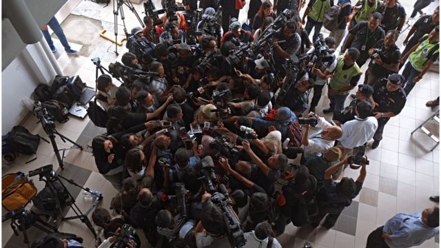 Shot from above of Gooi Soon Seng, the lawyer who represents Siti Aisyah, surrounded by camera operators and journalists, in the Sepang Magistrate Court building on 1 March 2017 in Sepang, Malaysia.
