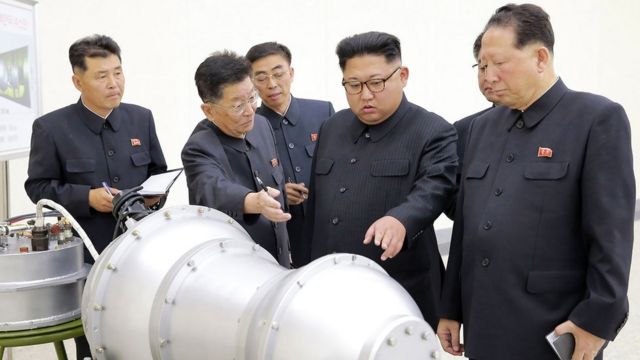 North Korean leader Kim Jong-un inspects a metal casing at an undisclosed location, 3 September 2017