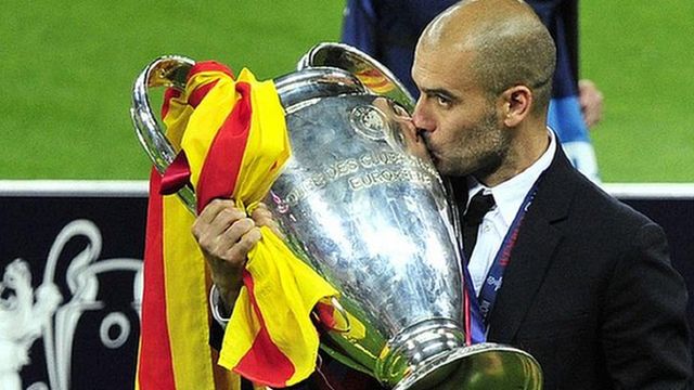 Pep Guardiola with the Champions League trophy after Barcelona beat Manchester United in 2011