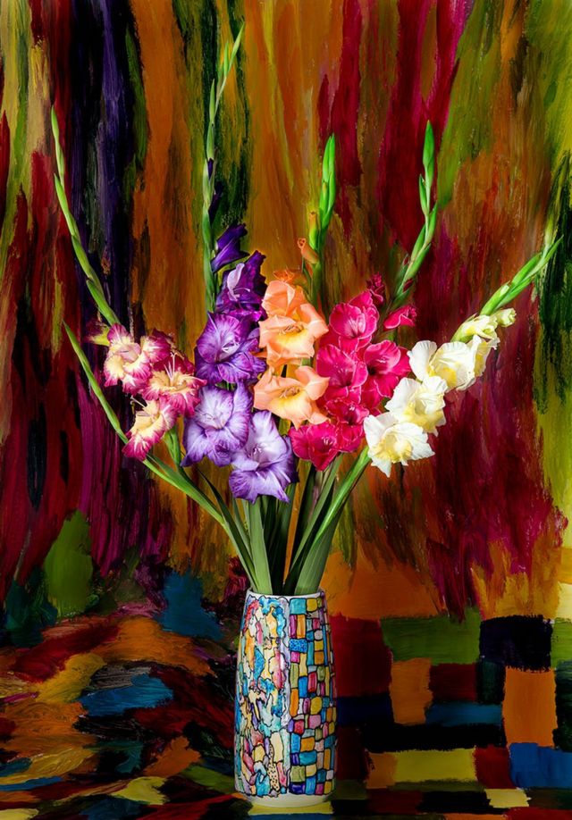 Colourful flowers in a colourful vase with a painted background behind