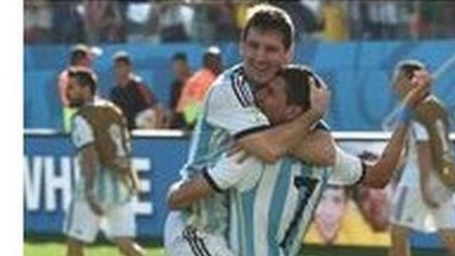 Lionel Messi and Angel Di Maria celebrate after Argentina beat Switzerland