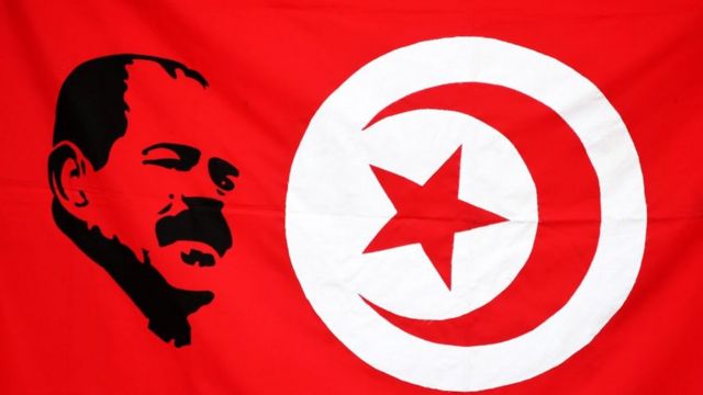 Shukri Belaid and the Tunisian flag