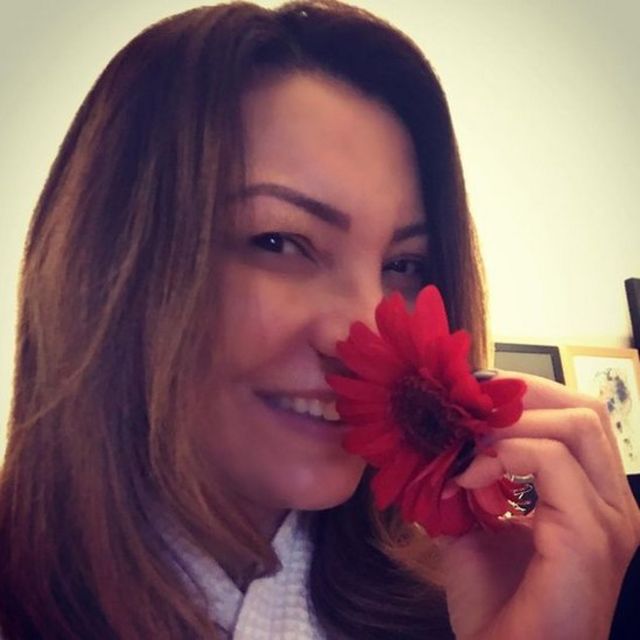 Rosangela da Silva with a flower