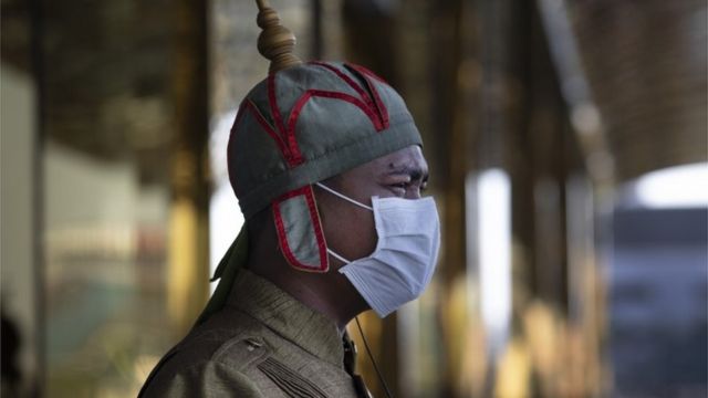 A Cambodian hotel guard wearing a mask stands outside the Nagaworld One hotel in Phnom Penh, Cambodia on February 12, 2020