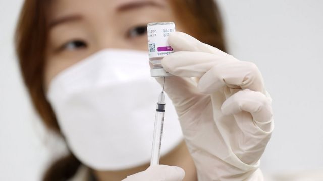 A medical worker prepares to give a shot of Vaxzevria (formerly AstraZeneca) COVID-19 vaccine at a public health facility in Seoul, South Korea