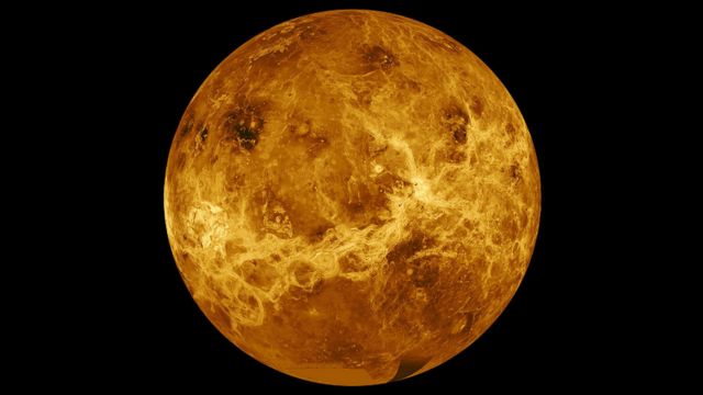 Venus, with a series of dark ridges and lighter features