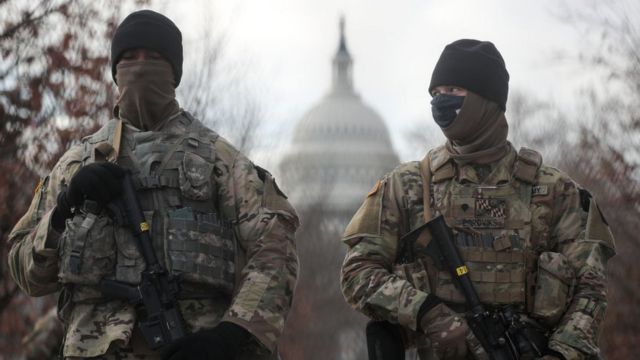 US National Guardsmen stand on a closed street outside the Capitol Building
