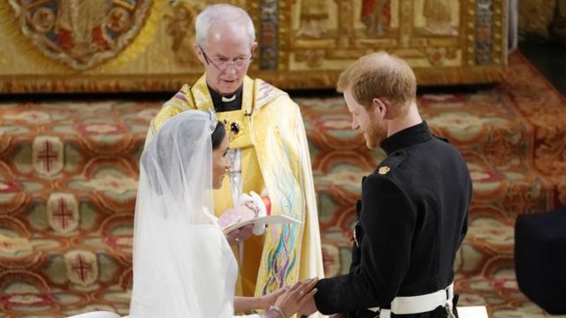 Prince Harry and Meghan Markle exchange vows in front of Justin Welby, the Archbishop of Canterbury, during their wedding ceremony in St George's Chapel at Windsor Castle on May 19, 2018 in Windsor,