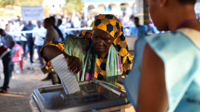 A women cast her ballot as part of the general elections, on March 7 at a polling station in Freetown. More than 3.1 million voters are registered for the polls.