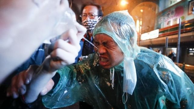 A pro-democracy protester rinses his face after riot police fired water canons with pepper spray during an anti-government protest in Bangkok, Thailand, 16 October 2020