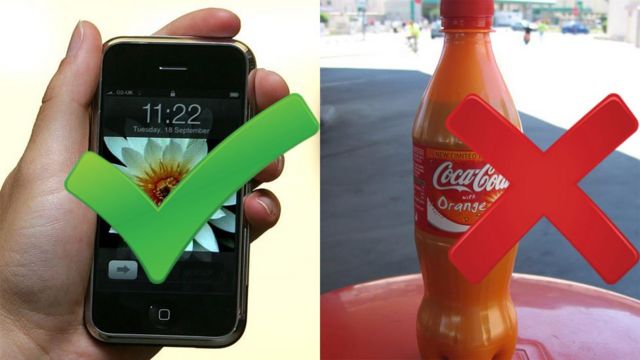An iPhone and a bottle of Coke Orange