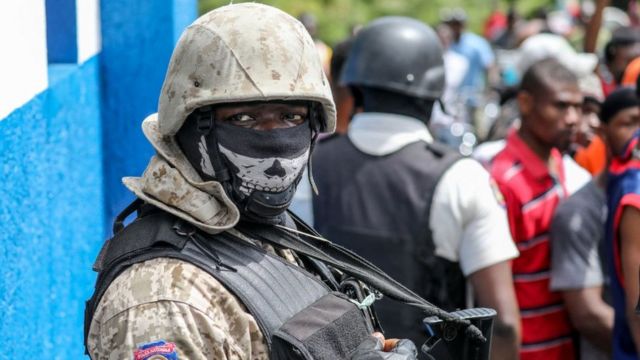 Haitian solder with a skull face mask