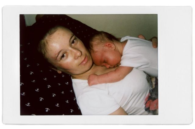 A polaroid photo of Liudmila and her baby