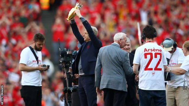 Wenger was presented with the golden trophy given to the club after their 2003-04 unbeaten 'Invincibles' season on the pitch after the match.