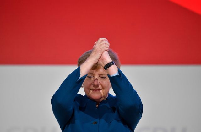 German Chancellor and leader of the Christian Democratic Union (CDU) Angela Merkel acknowledges the applause after delivering her speech at a party congress of Germany"s conservative Christian Democratic Union (CDU) party on December 7, 2018 at a fair hall in Hamburg, northern Germany. - German Chancellor Angela Merkel will hand off leadership of her party after nearly two decades at the helm, with the race wide open between a loyal deputy and a longtime rival. (Photo by John MACDOUGALL / AFP)JOHN MACDOUGALL/AFP/Getty Images