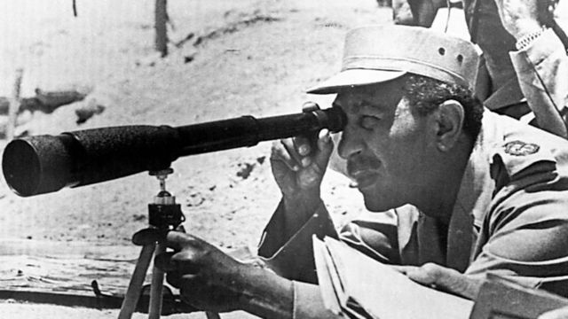 President Anwar Sadat of Egypt visits army positions at the Suez Canal during the October 1973 Arab-Israeli war