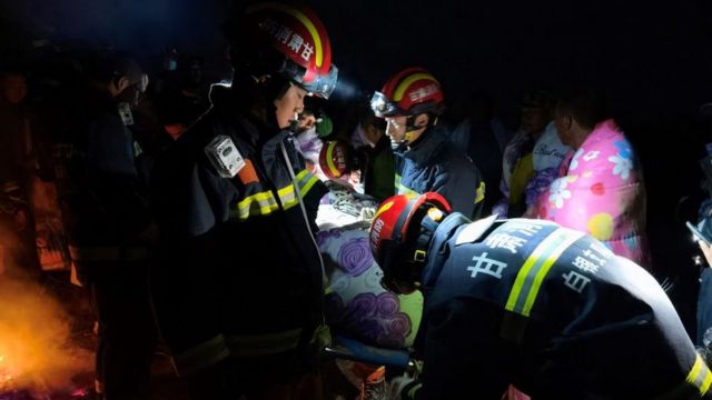 Rescuers assisting people who were competing in a cross-country mountain race when extreme weather hit the area