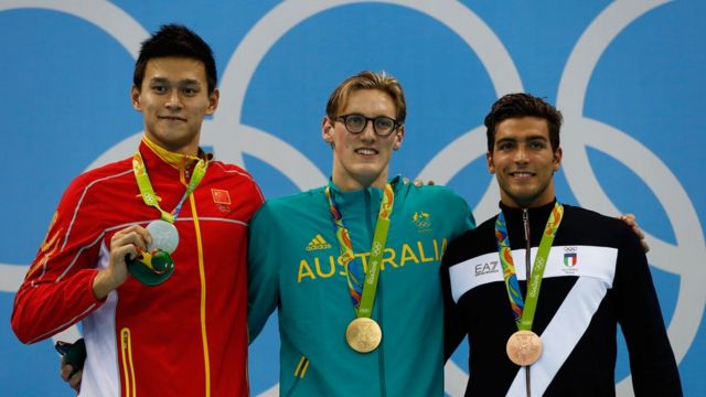 (L-R) Silver medalist Yang Sun of China, gold medal medalist Mack Horton of Australia and bronze medalist Gabriele Detti of Italy pose during the medal ceremony for the Final of the Men's 400m Freestyle on Day 1 of the Rio 2016 Olympic Games at the Olympic Aquatics Stadium on August 6, 2016 in Rio de Janeiro, Brazil.