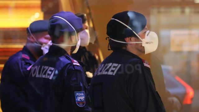Police wearing masks at a hotel in Innsbruck, Austria