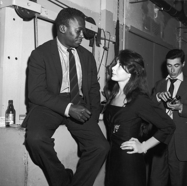 Miles Davis and his lover Juliette Greco at the Saint-Germain Club in Paris.  1958