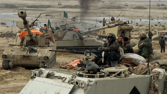 Saudi troops and US Special Forces move toward Kuwait City during the First Gulf War.