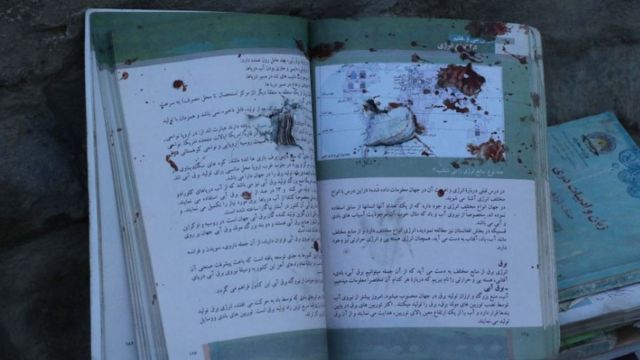 Aftermath of the attack shows blood stained books