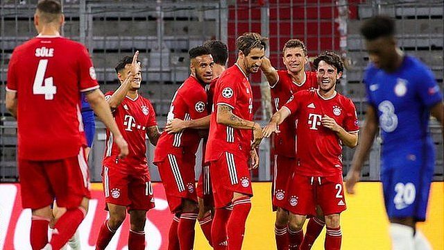 Bayern Munich's players celebrate scoring against Chelsea in the Champions League