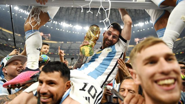 18 December: Lionel Messi of Argentina celebrates with the World Cup trophy after the team's victory against France at Lusail Stadium (photo by David Ramos)