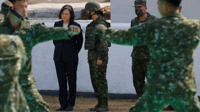 Tsai Ing-wen looks at a close combat demonstration in a military base in Chiayi on March 25, 2023