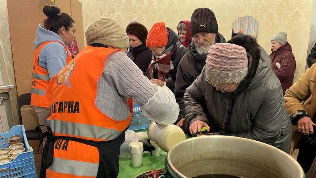 Aid groups provide food, which is distributed free of charge