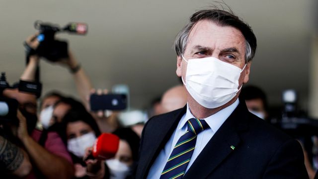 Brazil's President Jair Bolsonaro is seen after a meeting with Brazil's Lower House Arthur Lira at the Planalto Palace, in Brasilia, 30 March 2021