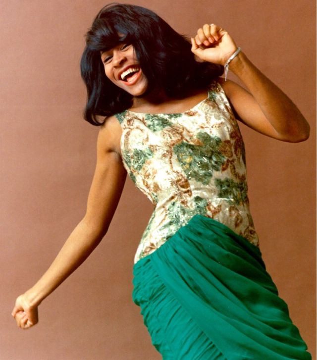 Tina Turner in a green dress