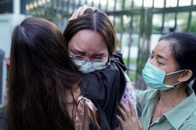 Protest leader Panusaya "Rung" Sithijirawattanakul, who has spent eight weeks in detention on charges of insulting the country"s king, reacts as she leaves after she was granted bail at the Central Women"s Correctional Institute in Bangkok, Thailand, May 6, 2021