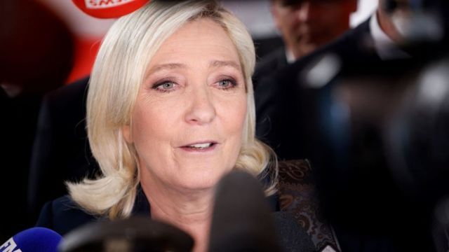 Marine Le Pen speaks to the press after a live televised debate won 20 April