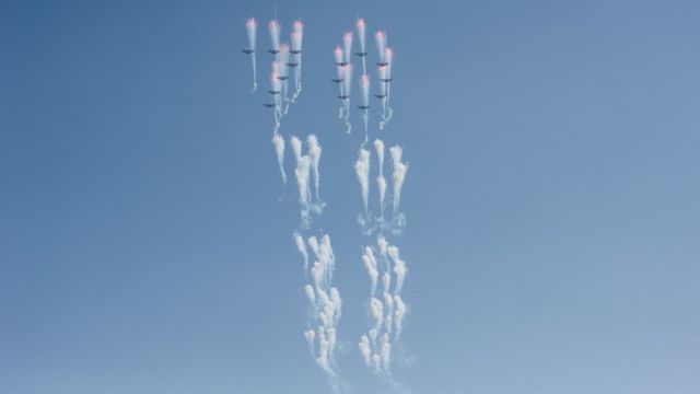 Aircrafts perform a fly-by during a mass rally