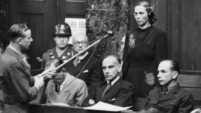 Inge Viermetz, the only woman defendant being tried before Tribune 1 in the RuSHA Nuremberg Trials, stands up to plead 'not guilty' to being responsible for the Lebensborn in Nazi Germany, October 23rd 1947. (Photo by Keystone/Hulton Archive/Getty Images)