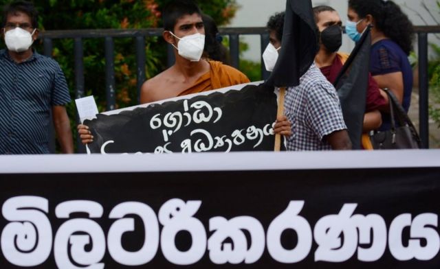 Inter-University student federation, Ceylon Teachers union &amp; Civil society activist holds on a placard during a protest against the release of trade union members and the proposed controversial General Sir Kotelawala National Defence University act. near Colombo, Sri Lanka July 12, 2021 (Photo by Akila Jayawardana/NurPhoto via Getty Images)